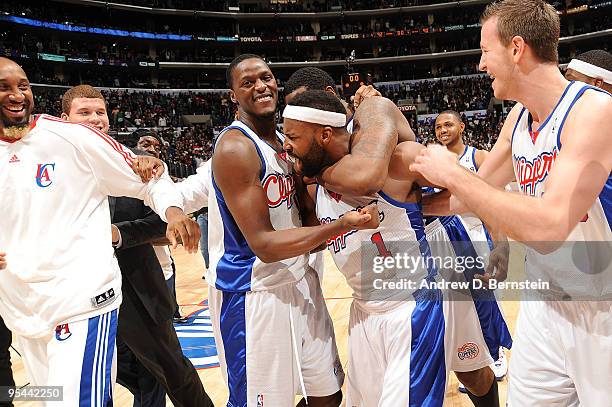 Baron Davis of the Los Angeles Clippers celebrates with teammates the 92-90 win over the Boston Celtics at Staples Center on December 27, 2009 in Los...