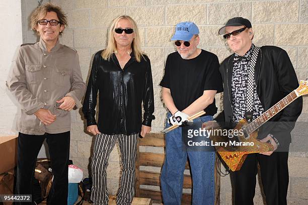 Tom Peterson, Robin Zander, Bun E. Carlos and Rick Nielsen of Cheap Trick pose backstage at the Miami Dolphins game at Landshark Stadium on December...