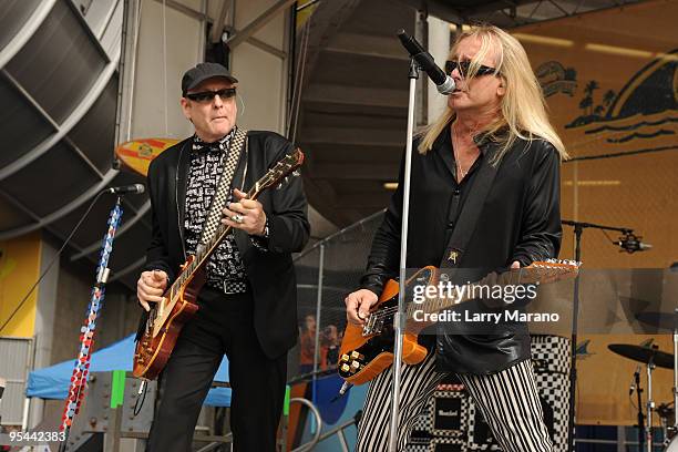 Rick Nielsen and Robin Zander of Cheap Trick perform on the tailgate stage at the Miami Dolphins game at Landshark Stadium on December 27, 2009 in...