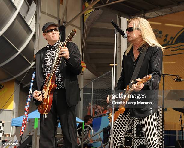 Rick Nielsen and Robin Zander of Cheap Trick perform on the tailgate stage at the Miami Dolphins game at Landshark Stadium on December 27, 2009 in...