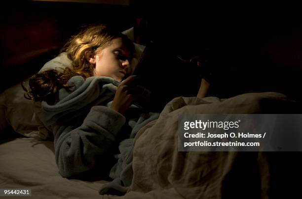 a young girl  reads - joseph o. holmes stock pictures, royalty-free photos & images