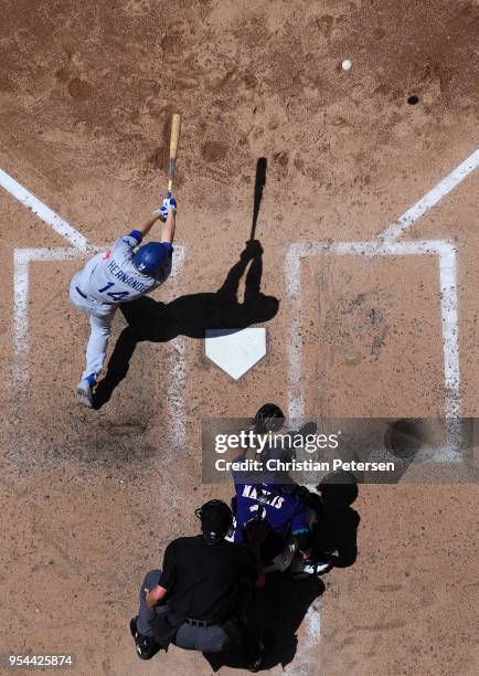 Enrique Hernandez of the Los Angeles Dodgers hits a ground ball out against the Arizona Diamondbacks during the sixth inning of the MLB game at Chase...