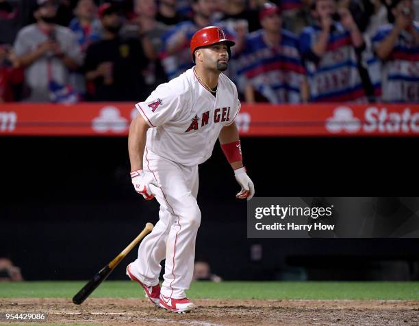 Albert Pujols of the Los Angeles Angels reacts to his pop fly out with 2999 career hits, during the ninth inning against the Baltimore Orioles at...