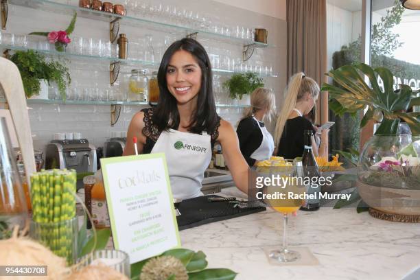 Bartender serves a cocktail during a 'Girls' Night In' hosted by Mandy Moore and Garnier at Hills Penthouse on May 3, 2018 in West Hollywood,...