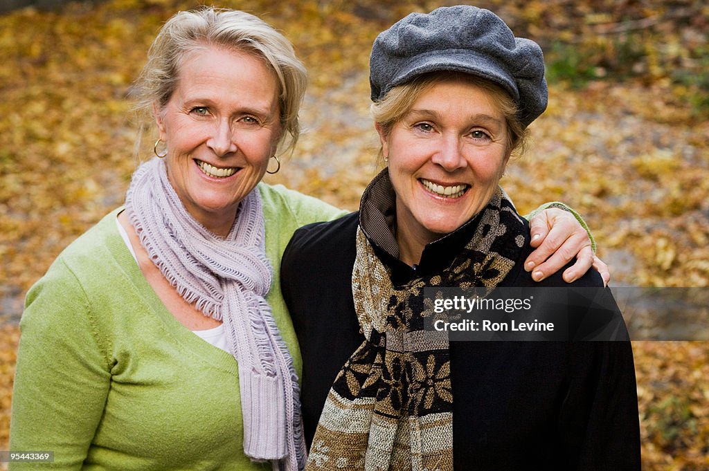 Middle-age sisters wearing scarves, portrait