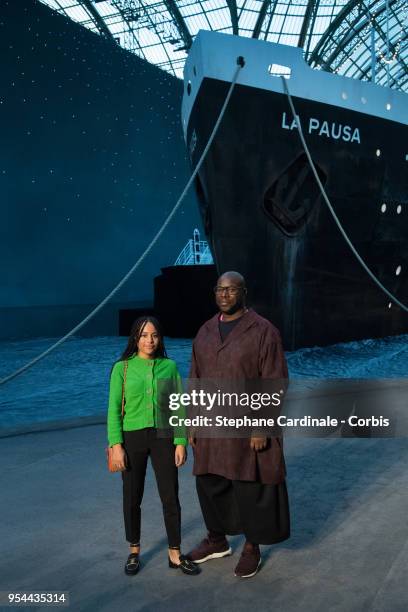 Steve McQueen and a guest attends the Chanel Cruise 2018/2019 Collection at Le Grand Palais on May 3, 2018 in Paris, France.