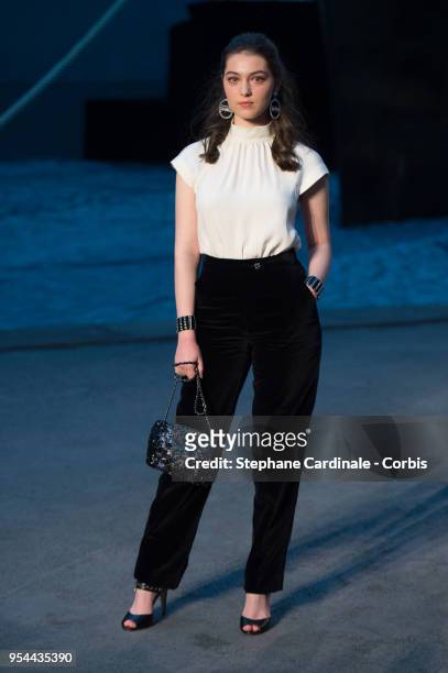 Anamaria Vartolomei attends the Chanel Cruise 2018/2019 Collection at Le Grand Palais on May 3, 2018 in Paris, France.