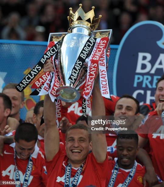 Nemanja Vidic lifts the trophy as Manchester United win the Barclays Premier League Championship following the match between Manchester United and...