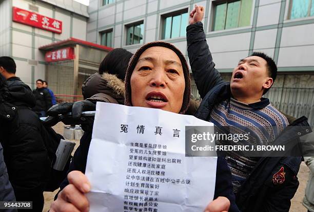 "Long live democracy, long live Liu Xiaobo!" shouts Beijing resident Song Zaimin as supporters of the leading Chinese and petitioners with their own...