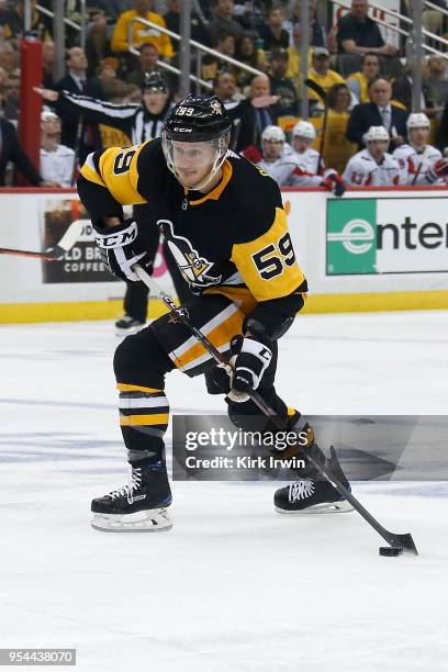 Jake Guentzel of the Pittsburgh Penguins controls the puck in Game Three of the Eastern Conference Second Round during the 2018 NHL Stanley Cup...