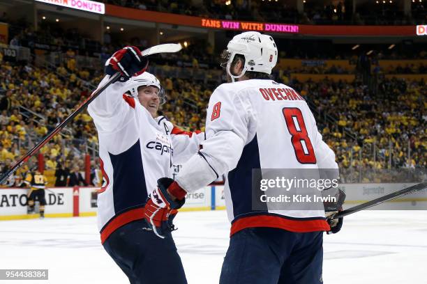 Nicklas Backstrom of the Washington Capitals congratulates Alex Ovechkin of the Washington Capitals after scoring the game winning goal in Game Three...