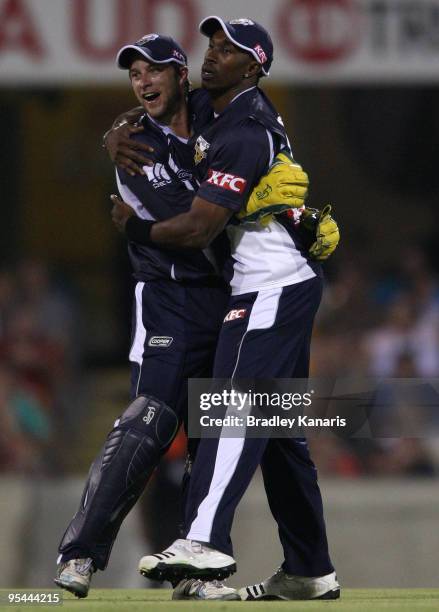 Dwayne Bravo of the BUshrangers celebrates with team mates after taking a catch to dismiss Chris Simpson of the Bulls during the Twenty20 Big Bash...