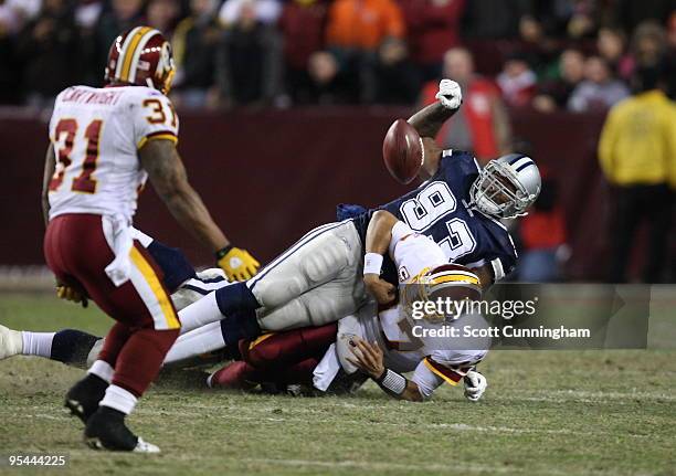 Anthony Spencer of the Dallas Cowboys strips the ball from Jason Campbell of the Washington Redskins at Fedex Field on December 27, 2009 in Landover,...