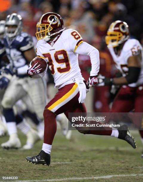 Santana Moss of the Washington Redskins runs with a catch against the Dallas Cowboys at Fedex Field on December 27, 2009 in Landover, Maryland.