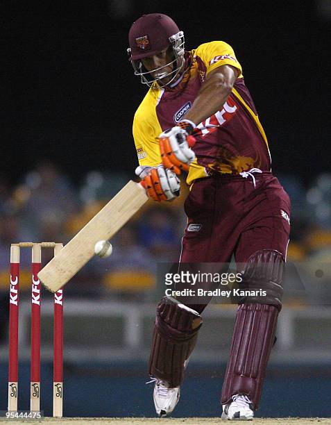 Andrew Symonds of the Bulls drives the ball to the boundary during the Twenty20 Big Bash match between the Queensland Bulls and the Victorian...