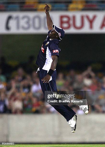 Dwayne Bravo of the Bushrangers celebrates after catching out Chris Simpson of the Bulls during the Twenty20 Big Bash match between the Queensland...