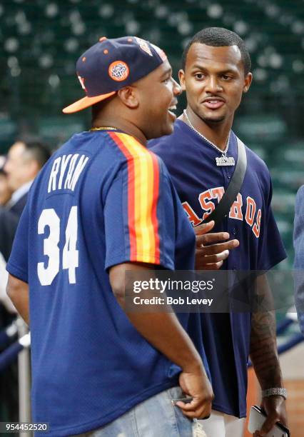 DeShaun Watson of the Houston Texans visits batting practice at Minute Maid Park on May 1, 2018 in Houston, Texas.