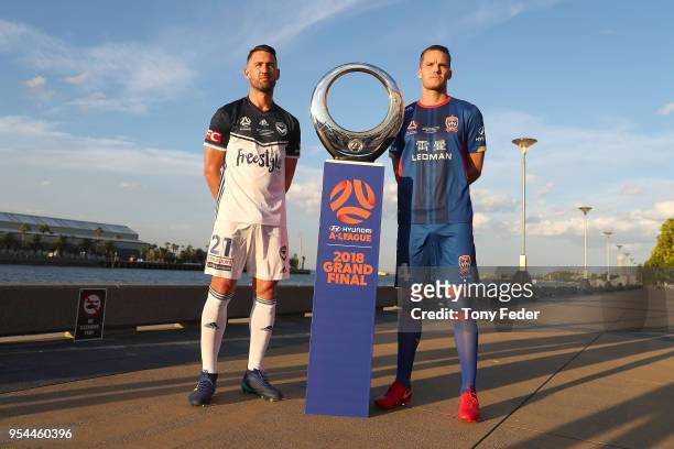Carl Valeri of Melbourne Victory and Nigel Boogaard of the Jets pose with the Hyundai A-League Champions Trophy at the Newcastle waterfront during a...
