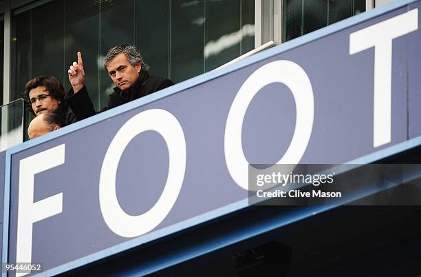 Ex-Chelsea manager Jose Mourinho, now coach of Inter Milan gestures from the stand as fitness coach Rui Faria looks on prior to the Barclays Premier...
