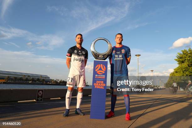 Carl Valeri of Melbourne Victory and Nigel Boogaard of the Jets pose with the Hyundai A-League Champions Trophy at the Newcastle waterfront during a...