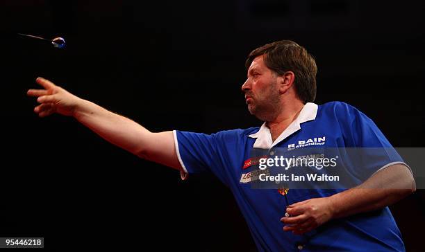 Denis Ovens of England in action against Colin Lloyd of England during the 2010 Ladbrokes.com World Darts Championship Round One at Alexandra Palace...