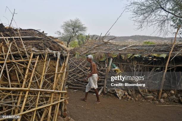 Man walks through Kraska village, Rajasthan, India, on Monday, April 16, 2018. The Indian government is trying to relocate the residents of Kraska, a...