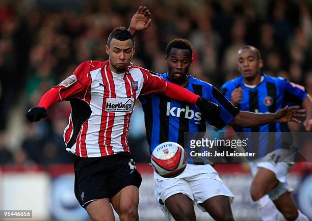 John Bostock of Brentford holds off Jose Semedo of Charlton Athletic during the Coca Cola League One match between Brentford and Charlton Athletic at...