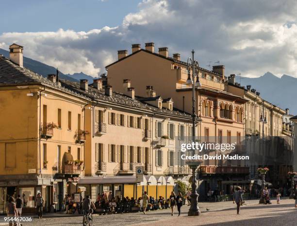 pedestrians and cafe in aosta, italy - valle daosta stock pictures, royalty-free photos & images