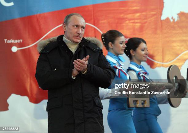 Russian Prime Minister Vladimir Putin attends the opening ceremony of Transneft's newly built oil-loading port of Kozmino December 28, 2009 near...