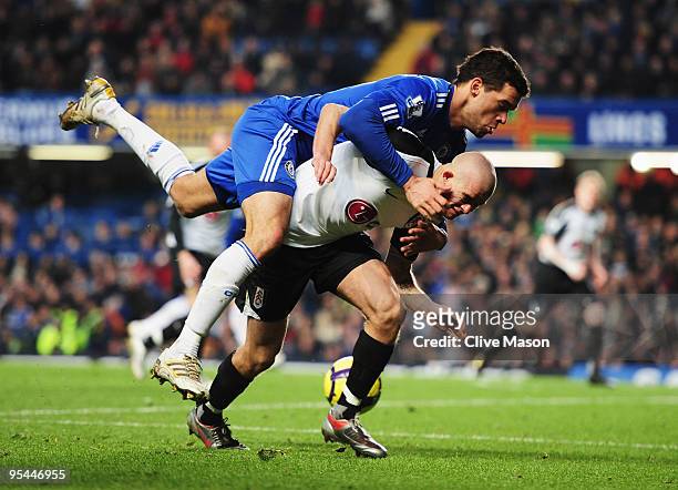 Paul Konchesky of Fulham battles with Michael Ballack of Chelsea during the Barclays Premier League match between Chelsea and Fulham at Stamford...