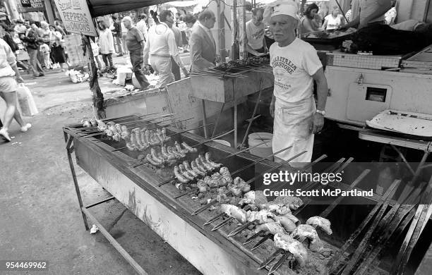 New York City - A food vendor prepares sausage and peppers at his concession stand at the annual Feast Of San Gennaro Festival in Little Italy.