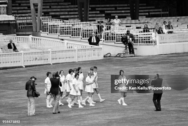 Rachael Heyhoe-Flint leads the England Women team onto the field for the first time at the start of the 2nd One Day International between England...