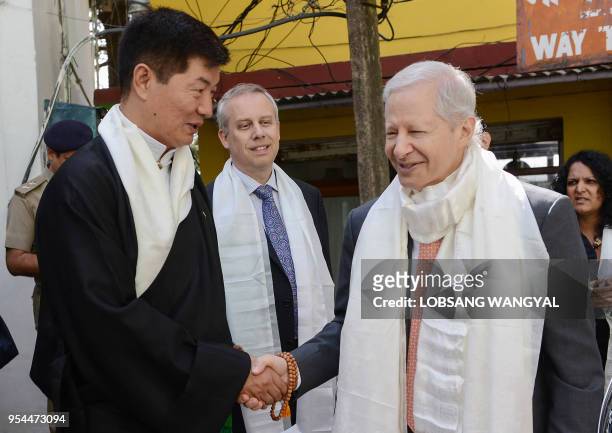 Ambassador to India Kenneth Juster shakes hands with President of Central Tibetan Administration Lobsang Sangay outside the Dalai Lama's residence...