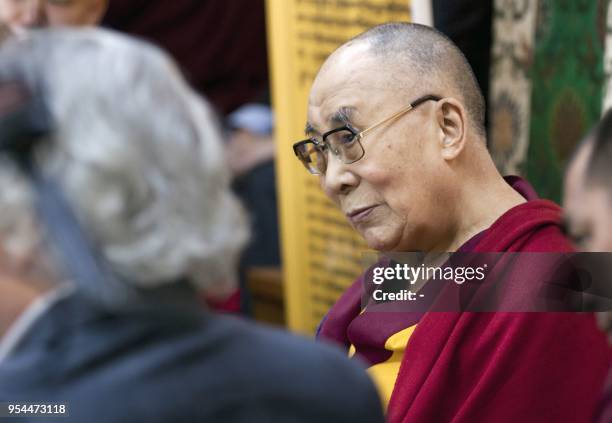 Tibetan spiritual leader the Dalai Lama interacts with monks and visiting scientists during a meeting for "the Dialogue between Russian Scientists...