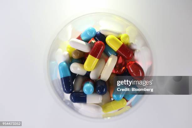 Brightly coloured pharmaceutical medication, including antibiotics, paracetamol, Ibuprofen and cold relief tablets, manufactured by a variety of...