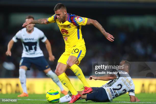 Jeremy Menez of America struggles for the ball with Marcelo Diaz of Pumas during the quarter finals first leg match between Pumas UNAM and America as...