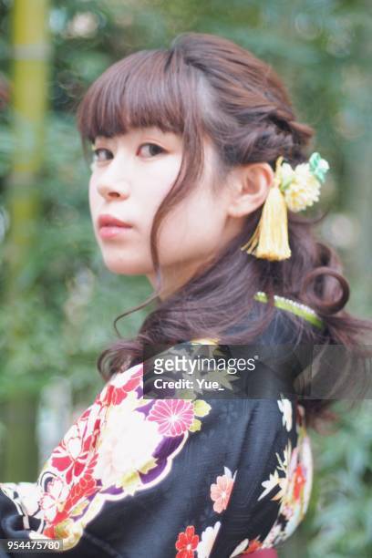 young woman wearing a kimono at the university's graduation ceremony - alumno vintage stock pictures, royalty-free photos & images