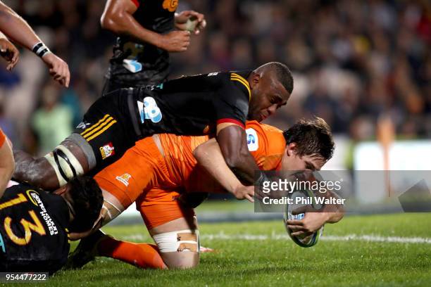 Tomas Lezana of the Jaguares is tackled during the round 12 Super Rugby match between the Chiefs and the Jaguares at Rotorua International Stadium on...