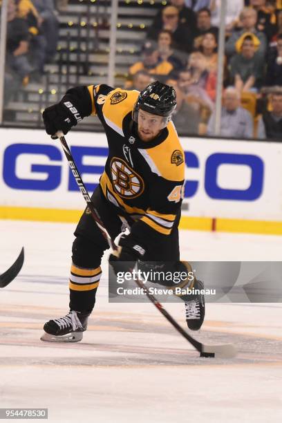 Matt Grzelcyk of the Boston Bruins shoots the puck against the Tampa Bay Lightning in Game Three of the Eastern Conference Second Round during the...