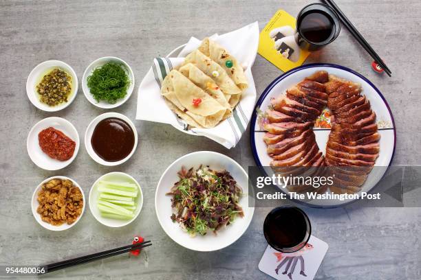 Whole Roast Duck with Flour Tortillas, Duck Confit Salad, Seasoned Hoisin Sauce, Hot Sauce, Cucumbers and Scallion at Spoken English, a...