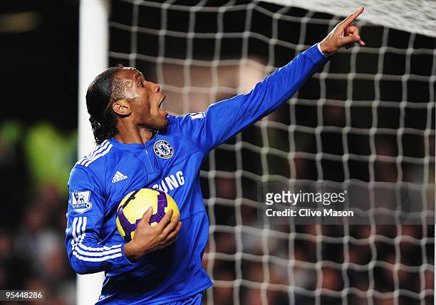 Didier Drogba of Chelsea celebrates as he scores their first goal during the Barclays Premier League match between Chelsea and Fulham at Stamford...