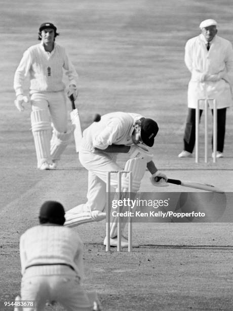 Tony Greig of England ducks under a bouncer from Andy Roberts of West Indies during the 4th Test match between England and West Indies at Headingley,...