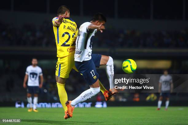 Paul Aguilar of America struggles for the ball with Jesus Gallardo of Pumas during the quarter finals first leg match between Pumas UNAM and America...