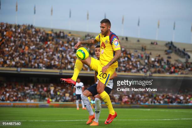 Jeremy Menez of America struggles for the ball with Pablo Barrera of Pumas during the quarter finals first leg match between Pumas UNAM and America...