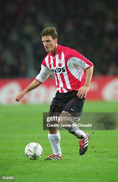 Arnold Bruggink of PSV Eindhoven runs with the ball during the UEFA Cup Quarter Finals second leg match against Kaiserslautern played at the Philips...