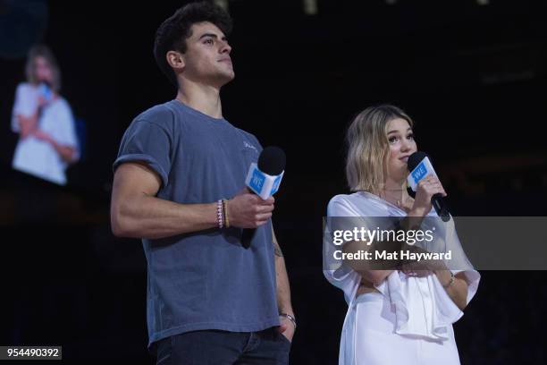 Jack Gilinsky and Olivia Holt speak on stage during WE Day at KeyArena on May 3, 2018 in Seattle, Washington.