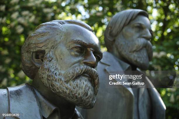 Statue of philosophers Karl Marx and Friedrich Engels stands in a public park on May 4, 2018 in Berlin, Germany. The German city of Trier, Marx's...