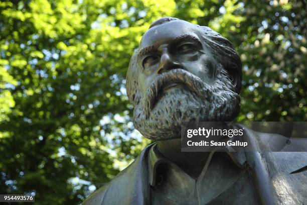 Statue of philosopher and revolutionary Karl Marx stands in a public park on May 4, 2018 in Berlin, Germany. The German city of Trier, Marx's...