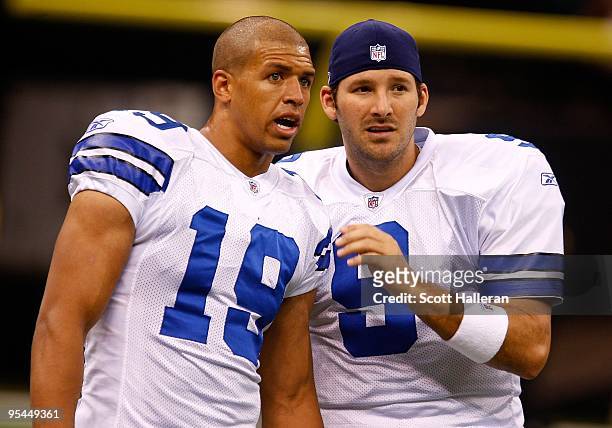 Tony Romo of the Dallas Cowboys is seen on the field alongside Miles Austin prior to the start of the game against the New Orleans Saints at the...