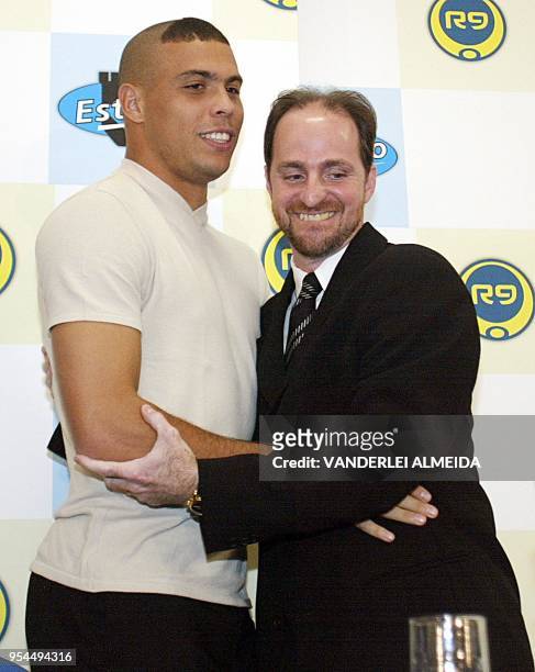 Brazilian soccer star, Ronaldo Nazario , greets his physiotherapist Nilton Petroni during the inauguration of the new Physiotherapy Faculty R9 at the...